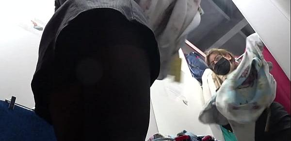  Voyeur peeks under her skirt in public. And with a hidden camera in a fitting room spies on a girl with a juicy ass in nylon tights. Foot fetish.